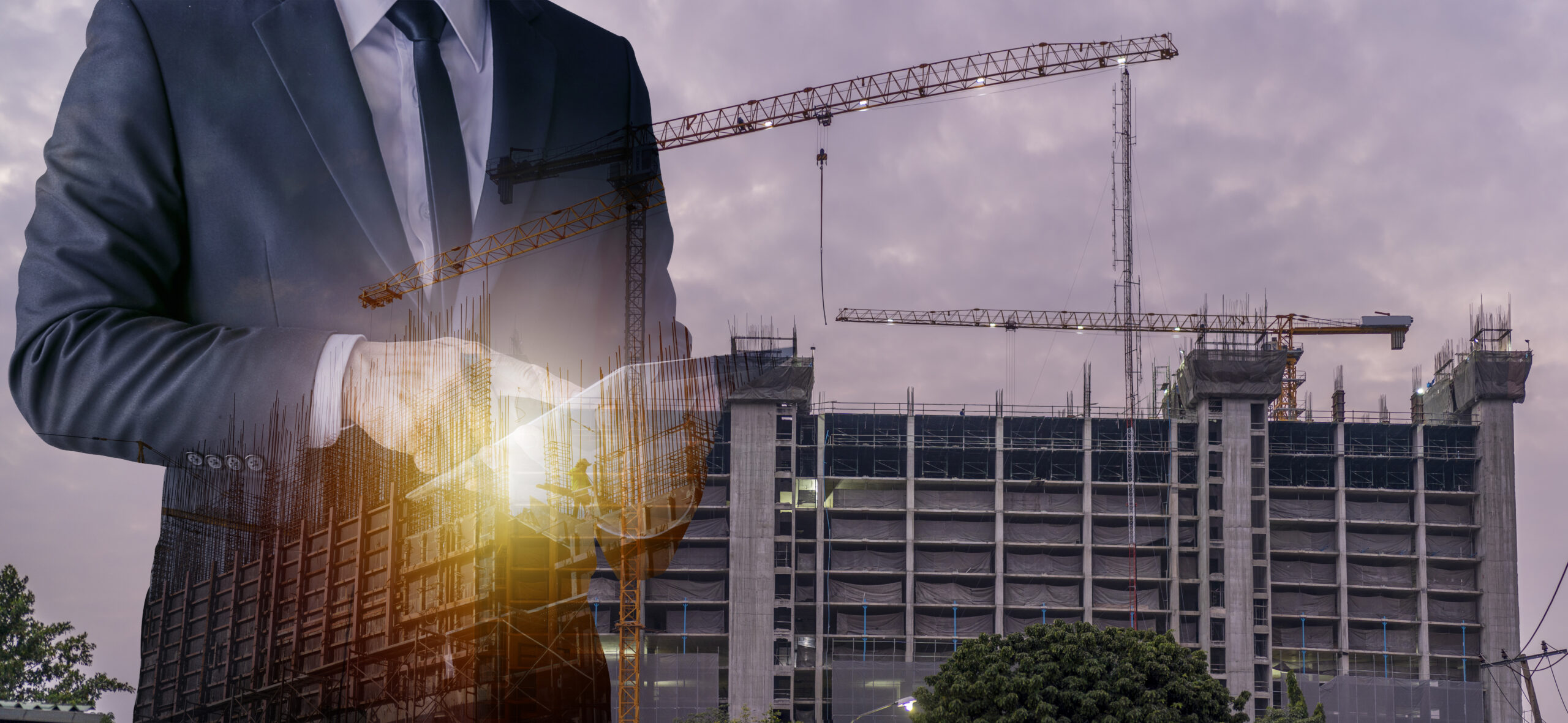 Double exposure image of construction worker with tablet compute